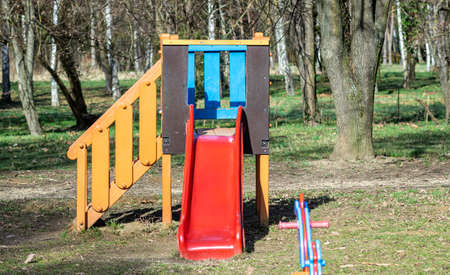 A colorful slide on a playground in a parkの写真素材