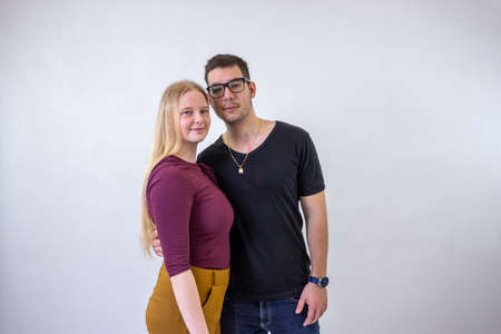 Portrait of young couple on white backgroundの写真素材