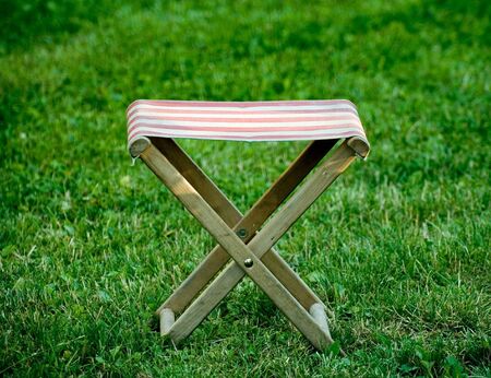 An X shaped seat on the lawnの写真素材