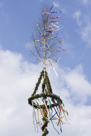 typical maypole in front of skyの写真素材