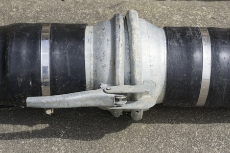 close up rustic metal pipe for farmland or agricultural automated watering system