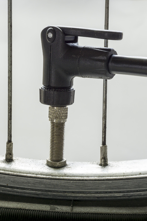 Closeup of tire valve of bicycle wheel,flat tireの写真素材