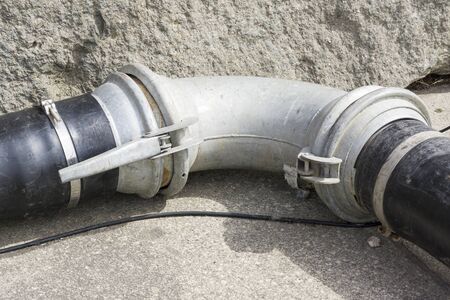 close up rustic metal pipe for farmland or agricultural automated watering systemの写真素材