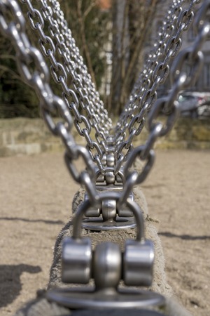 Chains on a toy in a playground.