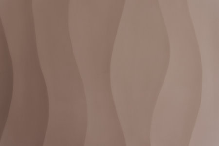 abstract background with smooth wavy lines in beige and brown colorsの写真素材
