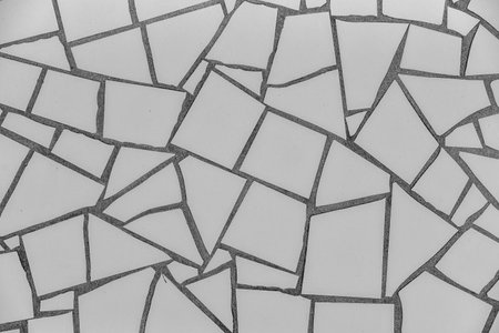 A white background with black squares. The squares are of different sizes and are not perfectly aligned. The squares are scattered all over the backgroundの写真素材