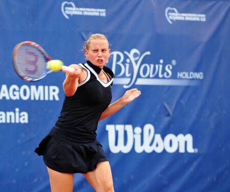 BUCHAREST - August 1: Australian Jelena Dokic in action during the finals of the $75,000 ITF / WTA tournament "Ruxandra Dragomir Open 2010" against Czech Zuzana Ondraskova, August 1 2010, Bucharest, Romania. Dokic won 3/6, 6/1, 7/6(3).のeditorial素材