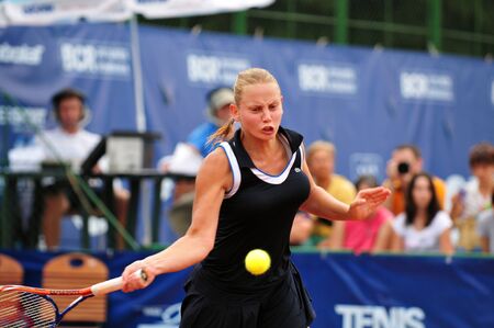 BUCHAREST - August 1: Australian Jelena Dokic in action during the finals of the $75,000 ITF / WTA tournament "Ruxandra Dragomir Open 2010" against Czech Zuzana Ondraskova, August 1 2010, Bucharest, Romania. Dokic won 3/6, 6/1, 7/6(3).のeditorial素材