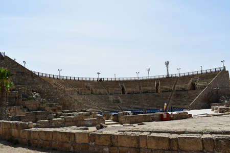Ruins of the ancient Roman amphitheater in the ancient city of Caesarea, on the coast of Mediterranean sea in Israel.の写真素材