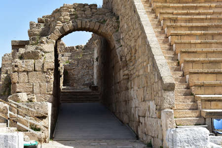 The ruins at the entrance of the ancient Roman amphitheater in the ancient city of Caesarea, Israel. Caesarea was a Roman city named after the Caesar and built by King Herod the Great.の写真素材
