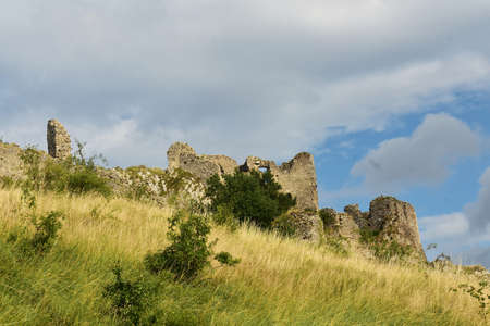 The ruins of the medieval fortress Trascau from Coltesti village, Transylvania, Romania.の写真素材