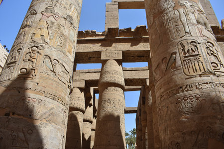 22- March- 2022. Ancient columns with drawings, in the great hypostyle hall, at the temple of Amun-Re in Karnak, Egypt.のeditorial素材