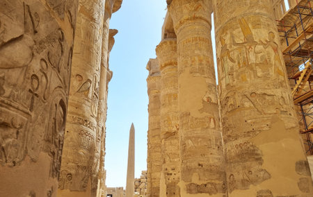 22- March- 2022. Ancient columns with drawings, in the great hypostyle hall, at the temple of Amun-Re in Karnak, Egypt.のeditorial素材
