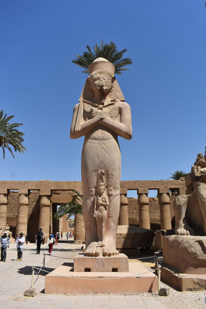 22- March- 2022. Statue of Pharaoh Ramses II with Queen Nefertari, at the Karnak Temple in Luxor, Egypt.のeditorial素材
