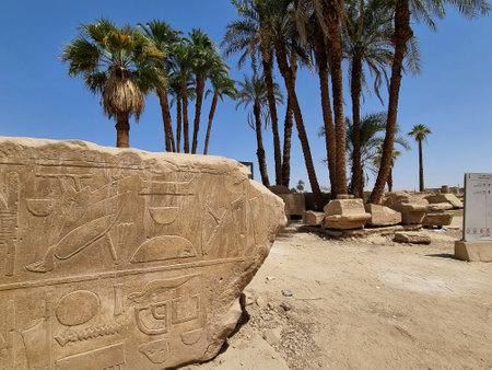 22- March- 2022. Ruins of Karnak Temple complex in Luxor, Egypt. Stones engraved with ancient Egyptian hieroglyphs and symbols.のeditorial素材