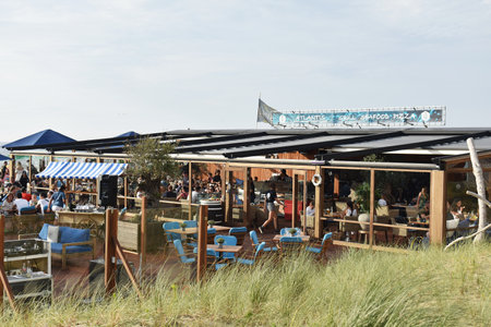 July- 18- 2020. Terrace of Atlantis Beach restaurant, along the boulevard of Scheveningen, Netherlands.のeditorial素材