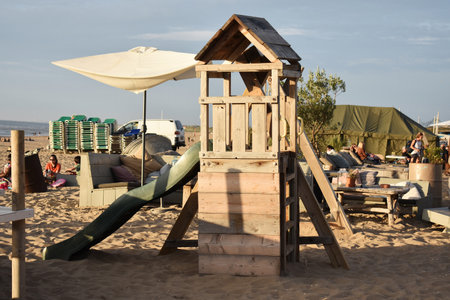 July- 18- 2020. Children's playground on Scheveningen beach, North Sea, Netherlands.のeditorial素材
