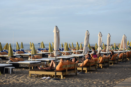 July- 18- 2020. Tourists laying on Luxury sunbeds on Scheveningen beach at North Sea, Netherlands.のeditorial素材
