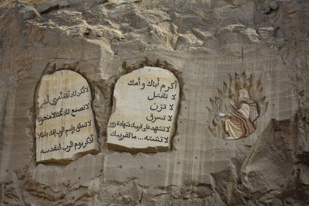 3- 17- 2022. St. Simon the Tanner Cathedral, also known as the Cave Church, in Cairo, Egypt. Rock carving, representing scenarios from the Bible.Ten commandments carved on rock.のeditorial素材
