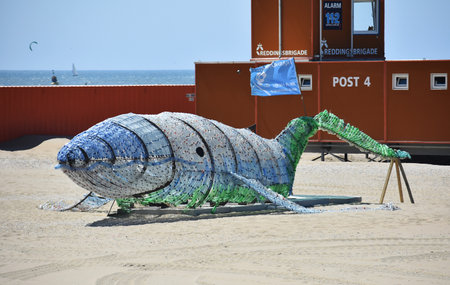 6-28- 2019, Scheveningen, The Hague, Netherlands.
Jojo, a massive whale made of 10.000 plastic bottles designed by  Caroline Dima from TrashUre Hunt, de Beach Summer Challenge.のeditorial素材