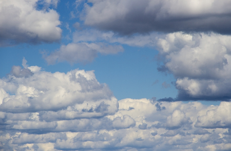 heavenly sky between the white clouds and the radiant sunの写真素材