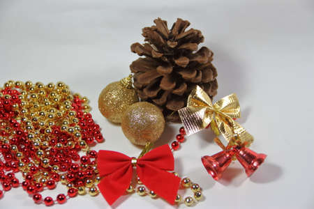 pineapples golden pearls and red bows and Christmas bellsの写真素材