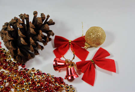 pineapples golden pearls and red bows and Christmas bellsの写真素材