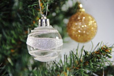 christmas balls on white golden tree with red backgrounds whiteの写真素材