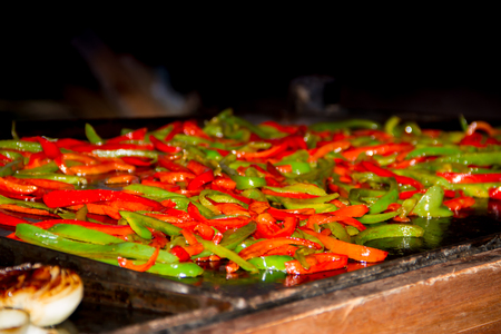 hands preparing tacos and felafel at street fairの写真素材