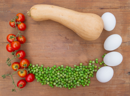 Vegetables on wood with place for textの写真素材