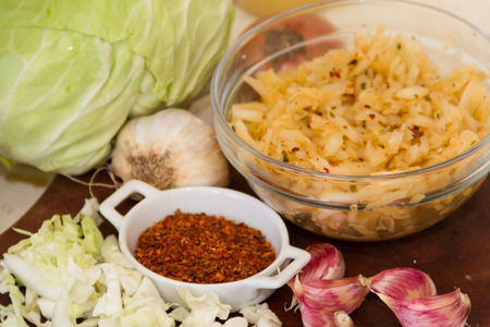 handmade preparation of sauerkraut and cabbage kimchiの写真素材
