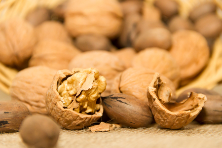 variety of healthy nuts on rustic backgroundの写真素材
