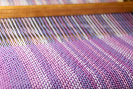 detail of fabric in comb loom with ultraviolet and lilac colorsの写真素材