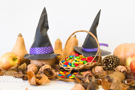 Basket with halloween candy and autumn decorationsの写真素材