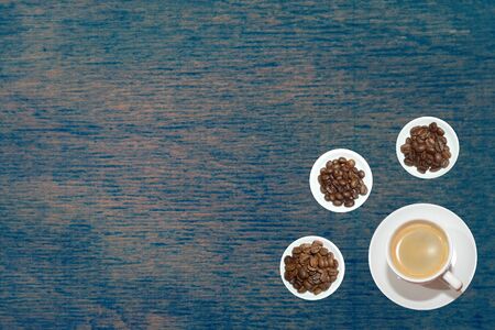 top view variety of roasted and green coffee beans on rustic backgroundの写真素材