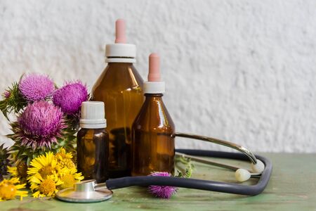 Health concept with essential oils of thistle for alternative medicinal useの写真素材