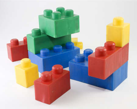 A lot of blocks to assemble in colours over white background isolated