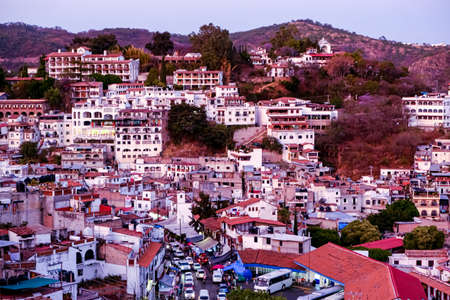 View of a town with only white houses. Sunset in Taxco, Guerrero Mexico. Latin America.の写真素材
