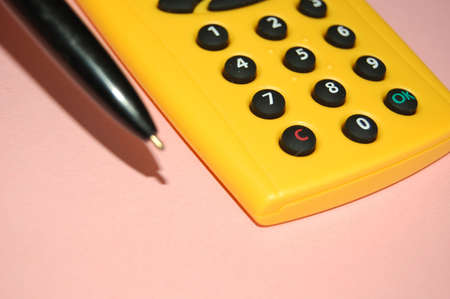 the calculator and ball point pen