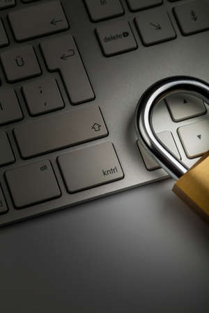 Close-up photograph of padlock and keyboard