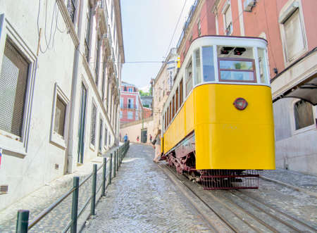Beautiful yellow tram in the streets of Lisbon, Portugalのeditorial素材