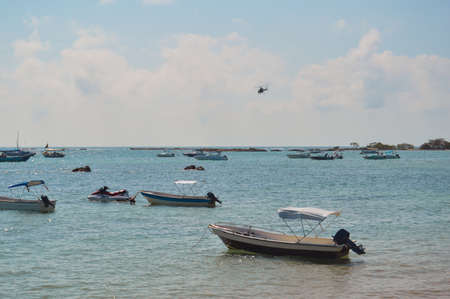Boat on the beach at Morro de Sao Paulo, Brazilの写真素材