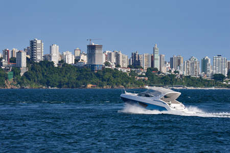 Yacht crossing water at Bahia, Brazilの写真素材