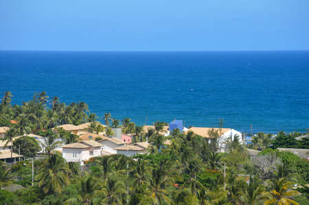 Landscape of a blue ocean and green trees at Salvador, Bahiaの写真素材
