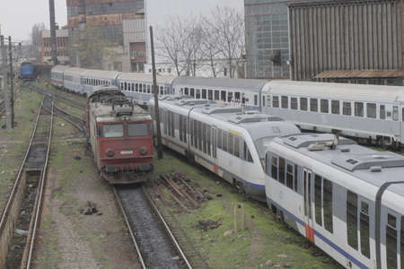Bucharest, Romania, March 13, 2016: Passenger trains are seen the switch yard of Gara de Nord main railway station.のeditorial素材