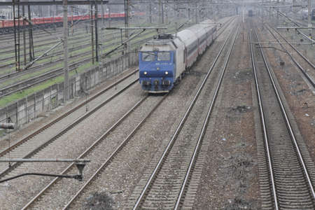 Bucharest, Romania, March 13, 2016: Passenger trains are seen the switch yard of Gara de Nord main railway station.のeditorial素材