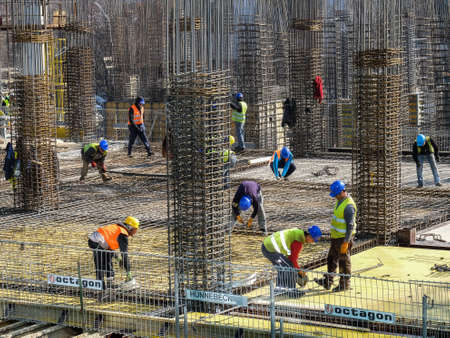 Bucharest, Romania, 9  February 2016: Laborers work at the construction site of a building in Bucharest.のeditorial素材