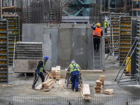 Bucharest, Romania, 12  February 2016: Laborers work at the construction site of a building in Bucharest.のeditorial素材