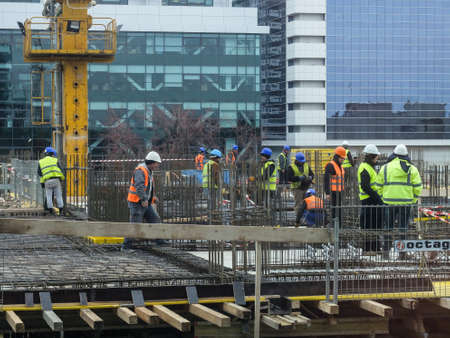 Bucharest, Romania, 19  February 2016: Laborers work at the construction site of a building in Bucharest.のeditorial素材
