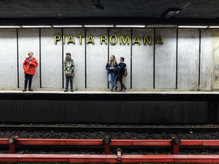 Bucharest, Romania, 21 February 2016: Teenagers are waiting for the metro in Piata Romana subway station in Bucharest.のeditorial素材